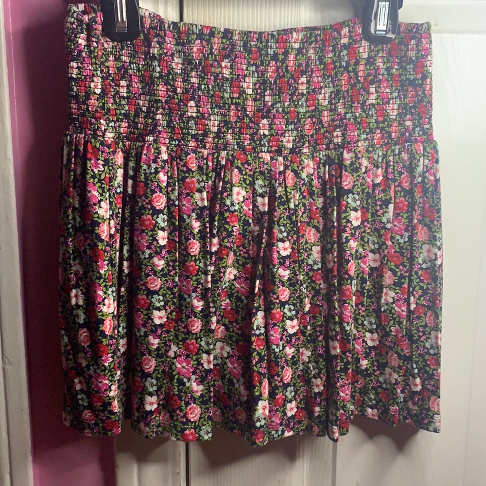 A above the knee skirt with flower designs.